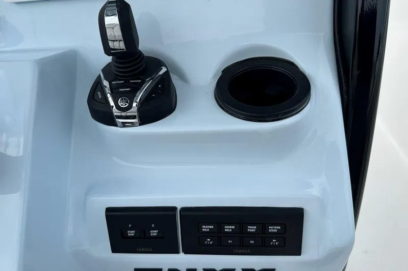 Slide: The Image of Control panel of 2026 Tidewater 272 LXF boat with joystick and buttons. - 29