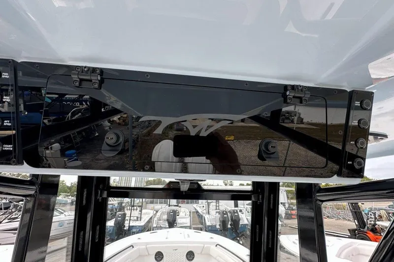 Slide: The Image of 2026 Tidewater 272 LXF boat dashboard with control panel and switches. - 32