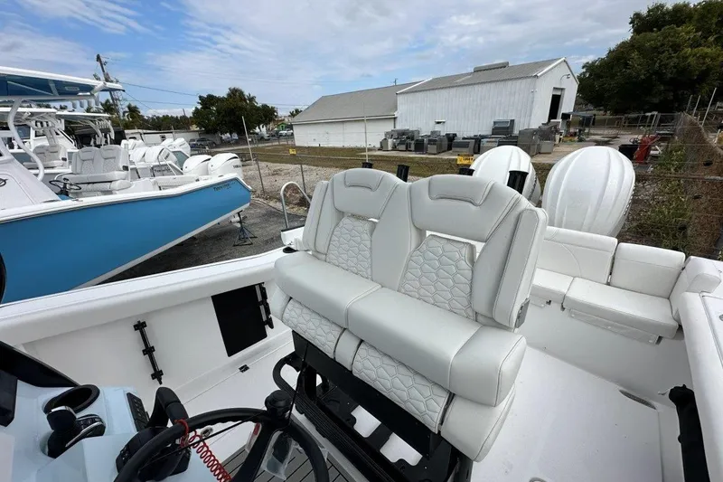 Slide: The Image of 2026 Tidewater 272 LXF boat interior with luxurious seating and modern design. - 9