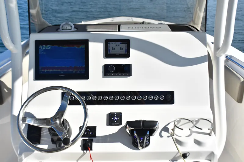 Slide: The Image of 2024 Key West 263 FS boat dashboard with modern navigation and control systems. - 14