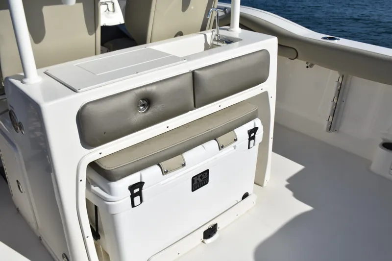 Slide: The Image of 2024 Key West 263 FS boat interior with seating and cooler storage. - 21