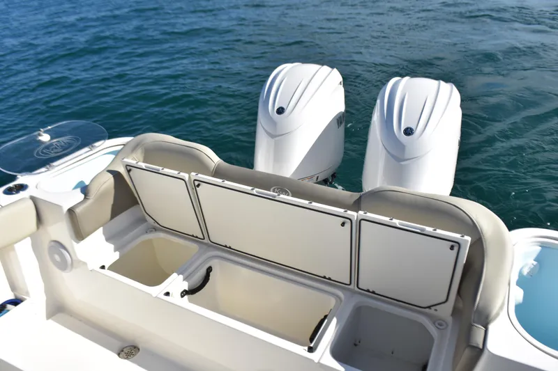 Slide: The Image of 2024 Key West 263 FS boat with dual outboard engines on the water. - 23