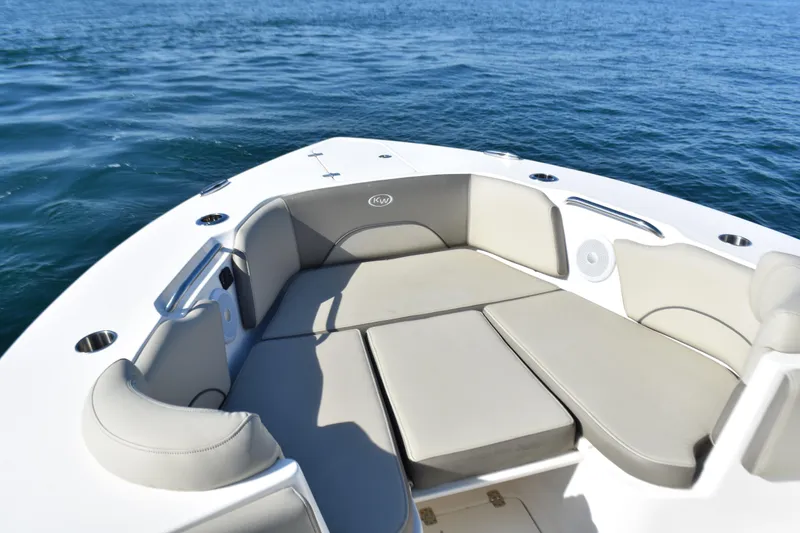 Slide: The Image of 2024 Key West 263 FS boat with spacious seating on calm ocean waters. - 9