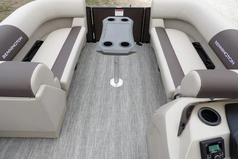 Slide: The Image of Interior of 2026 Bennington S Swingback 21 SSB pontoon boat with seating and table. - 12