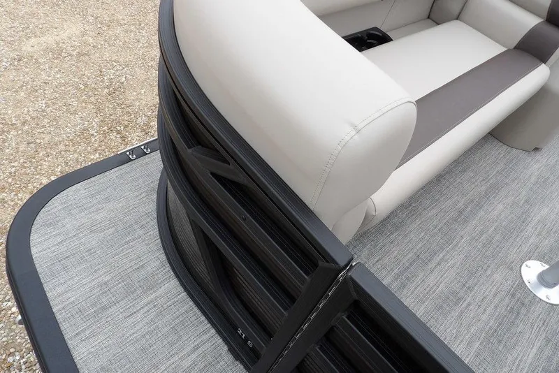 Slide: The Image of 2026 Bennington S Swingback 21 SSB boat interior with beige seating and gray flooring. - 14