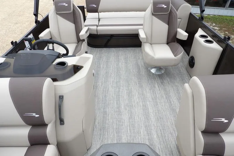 Slide: The Image of 2026 Bennington S Swingback 21 SSB interior with plush seating and modern helm. - 16