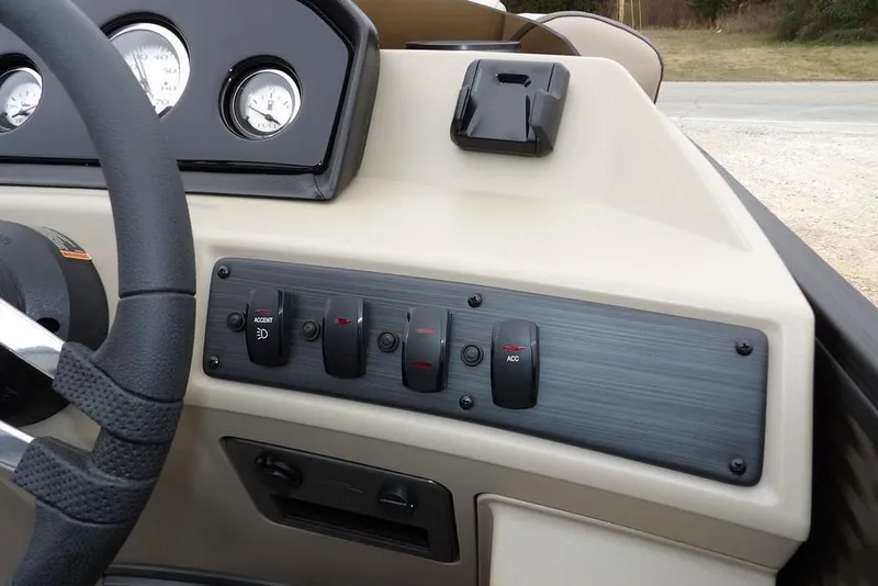 Slide: The Image of Dashboard controls of 2026 Bennington S Swingback 21 SSB boat, featuring switches and gauges. - 20