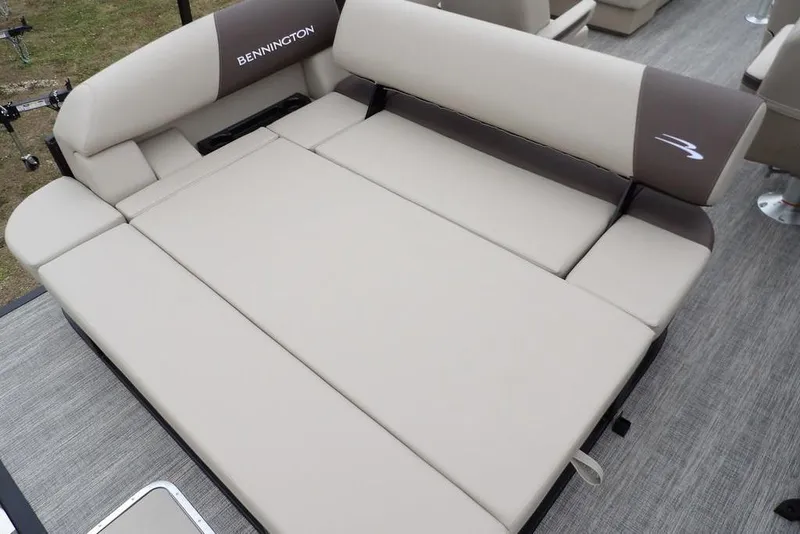 Slide: The Image of 2026 Bennington S Swingback 21 SSB boat interior with beige cushioned seating. - 22