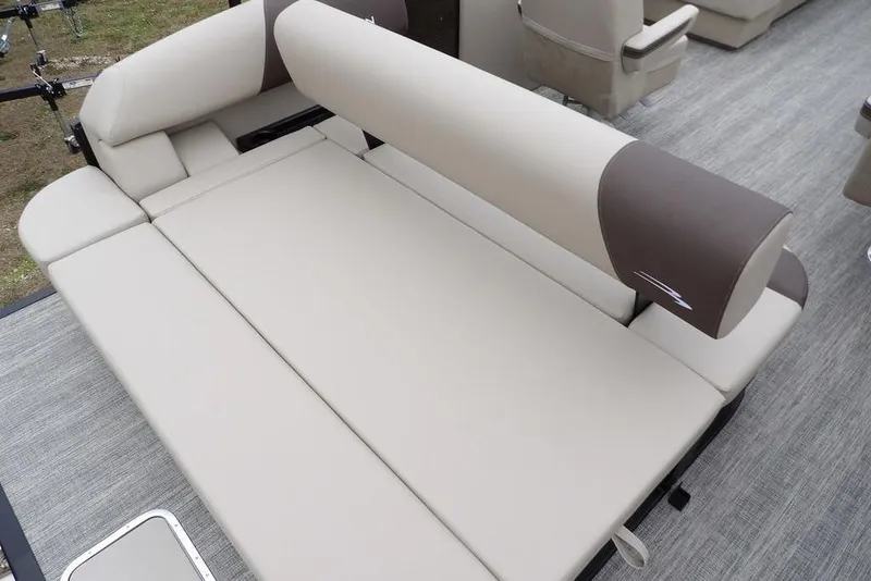 Slide: The Image of 2026 Bennington S Swingback 21 SSB boat interior with beige and brown seating. - 23