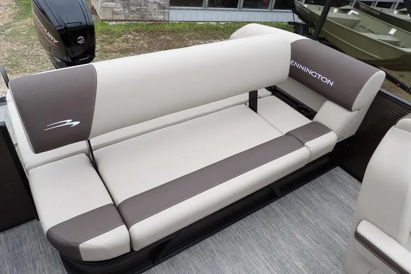 Slide: The Image of 2026 Bennington S Swingback 21 SSB boat seating, featuring beige and brown upholstery. - 25