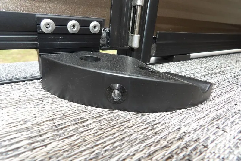 Slide: The Image of Close-up of Bennington S Swingback 21 SSB 2026 boat hinge detail on textured surface. - 26