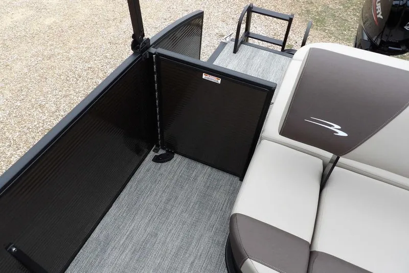 Slide: The Image of 2026 Bennington S Swingback 21 SSB boat interior with seating and safety gate. - 27