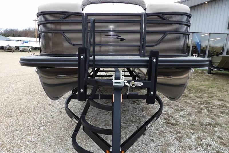 Slide: The Image of 2026 Bennington S Swingback 21 SSB pontoon boat on trailer, front view. - 3