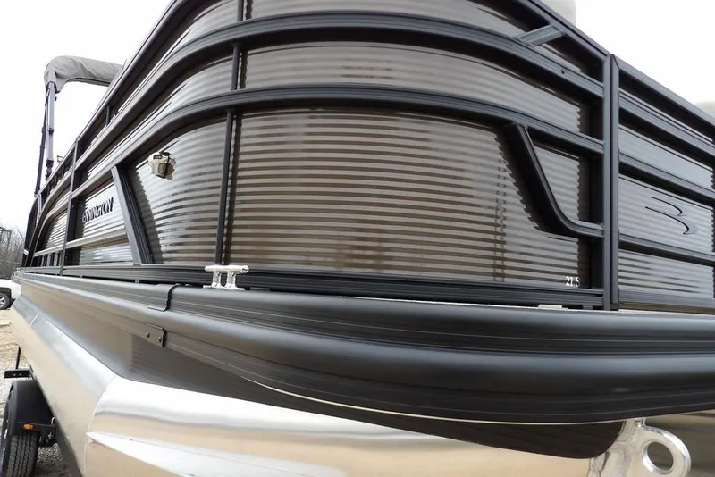 Slide: The Image of 2026 Bennington S Swingback 21 SSB pontoon boat, sleek design, close-up view. - 37
