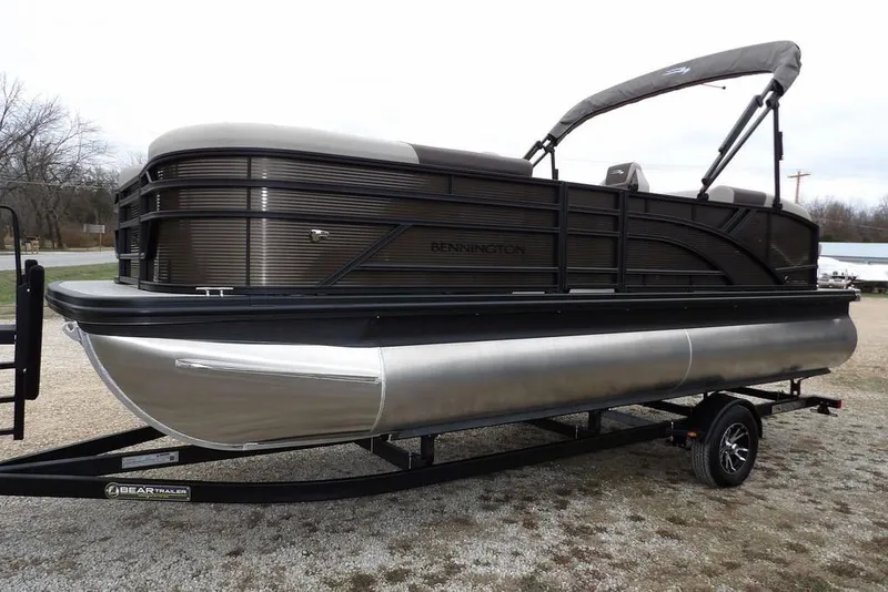 Slide: The Image of 2026 Bennington S Swingback 21 SSB pontoon boat on trailer, side view. - 7