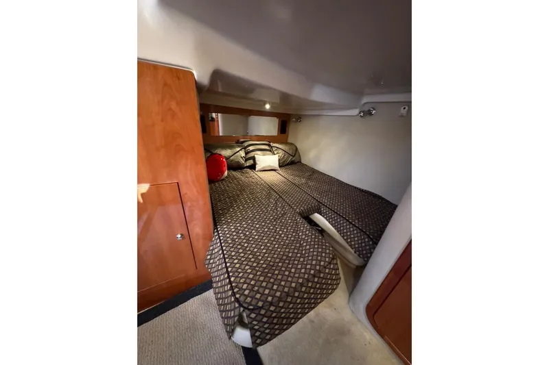 Slide: The Image of Luxurious cabin interior of 2006 Regal Commodore 4460 yacht with cozy bedding. - 18
