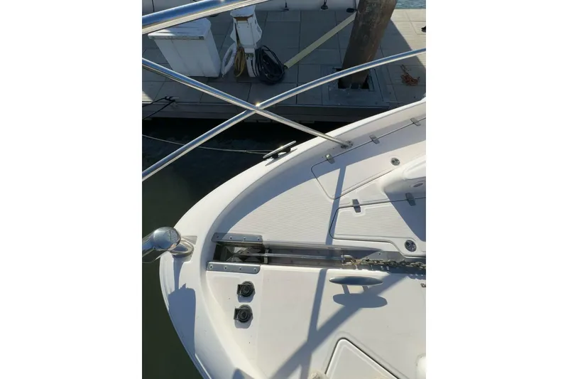 Slide: The Image of 2006 Regal Commodore 4460 boat deck with railing and anchor chain. - 29