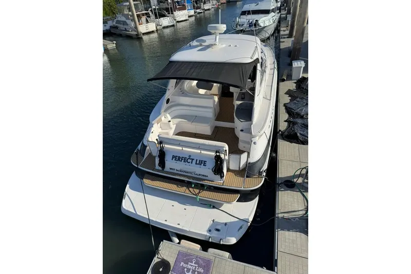 Slide: The Image of 2006 Regal Commodore 4460 yacht docked at marina, rear view. - 37