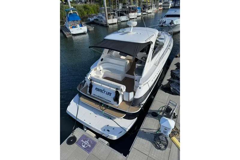 Slide: The Image of 2006 Regal Commodore 4460 yacht docked at marina, rear view. - 39