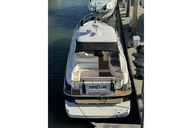Slide: The Image of 2006 Regal Commodore 4460 yacht docked at marina, aerial view. - 40