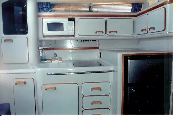 Slide: The Image of Sea Ray 310 Express Cruiser 1990 - 5