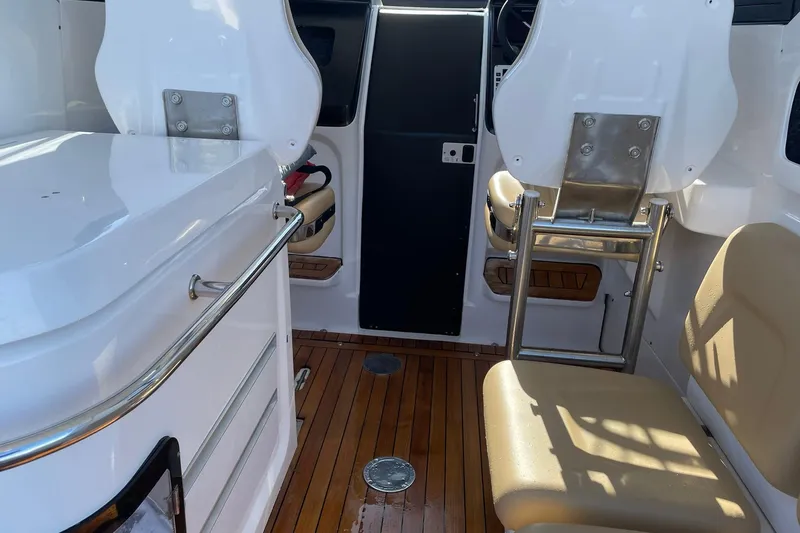 Slide: The Image of Interior of 2023 Flexboat Flex 680 Explorer with wooden flooring and seating. - 2