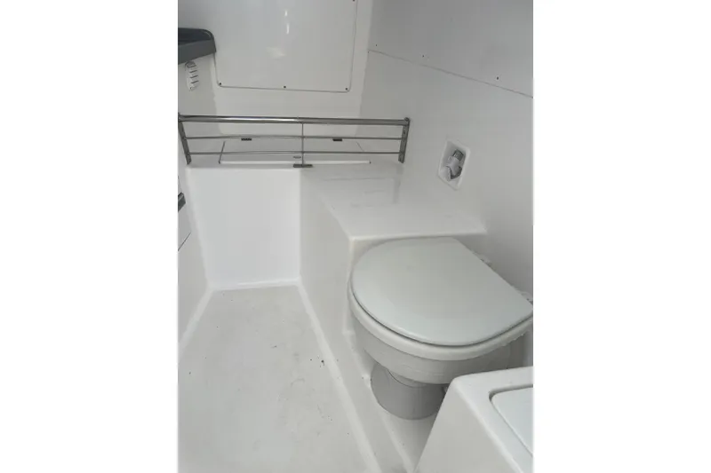 Slide: The Image of 2023 Flexboat Flex 680 Explorer interior with compact marine toilet. - 5