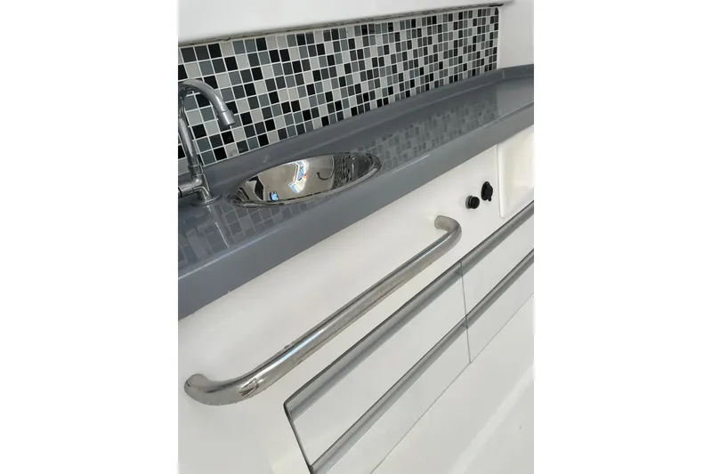 Slide: The Image of 2023 Flexboat Flex 680 Explorer interior with sleek sink and modern backsplash design. - 6