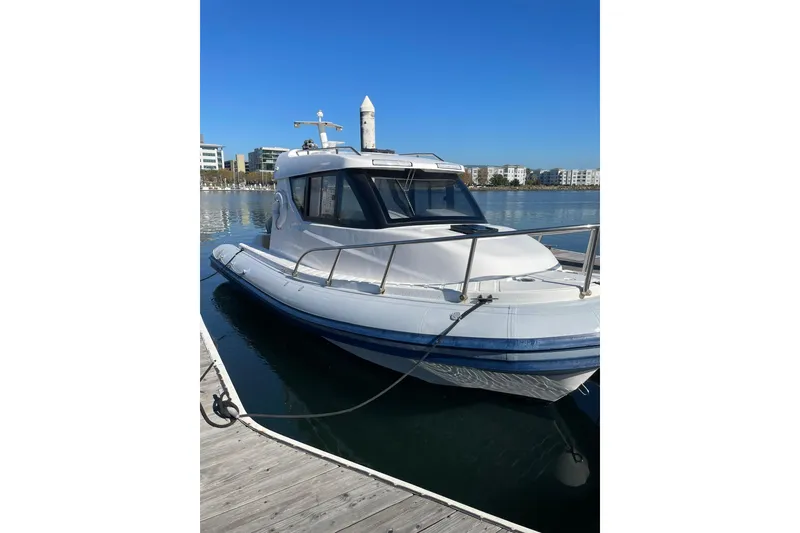 Slide: The Image of 2023 Flexboat Flex 680 Explorer docked on a sunny day. - 8