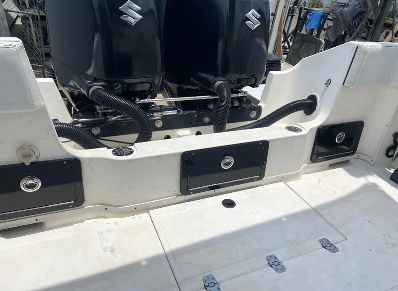 Slide: The Image of 1993 Fountain Walk Around boat with dual Suzuki engines, rear deck view. - 4