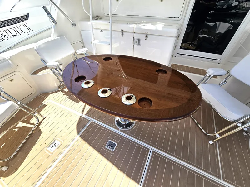 Slide: The Image of Luxurious wooden table on Riviera 42 Flybridge yacht, 2005 model. - 11