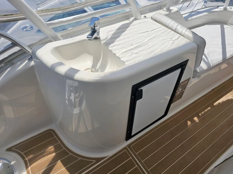 Slide: The Image of Riviera 42 Flybridge 2005 with sink and wooden deck. - 14