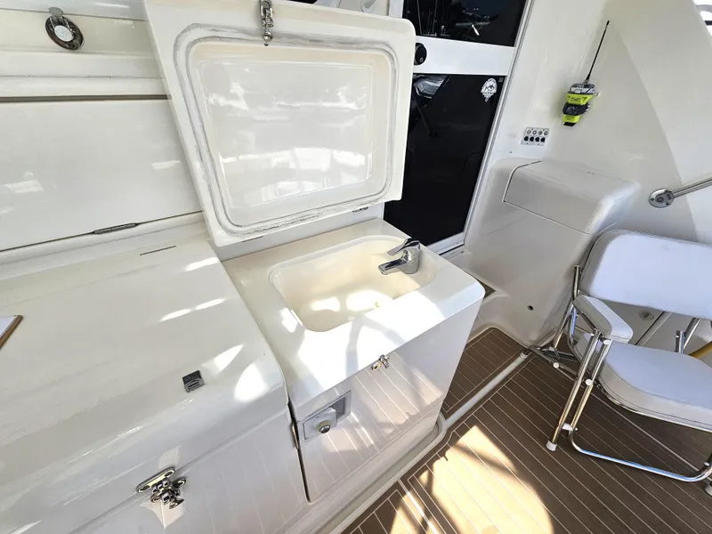 Slide: The Image of 2005 Riviera 42 Flybridge yacht interior with sink and seating. - 15