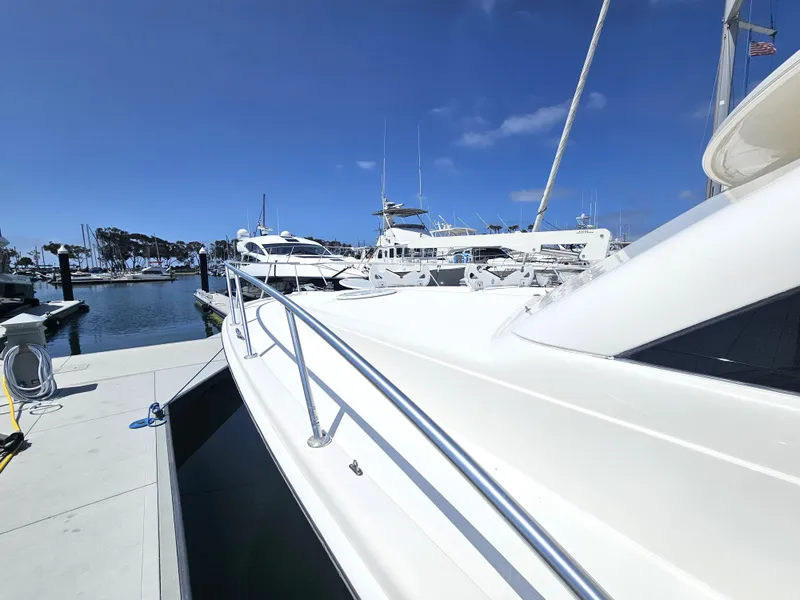 Slide: The Image of Riviera 42 Flybridge 2005 docked at marina on sunny day. - 16