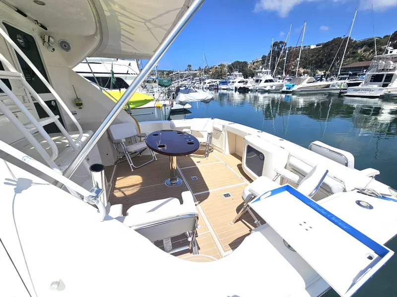 Slide: The Image of 2005 Riviera 42 Flybridge yacht in marina. - 18
