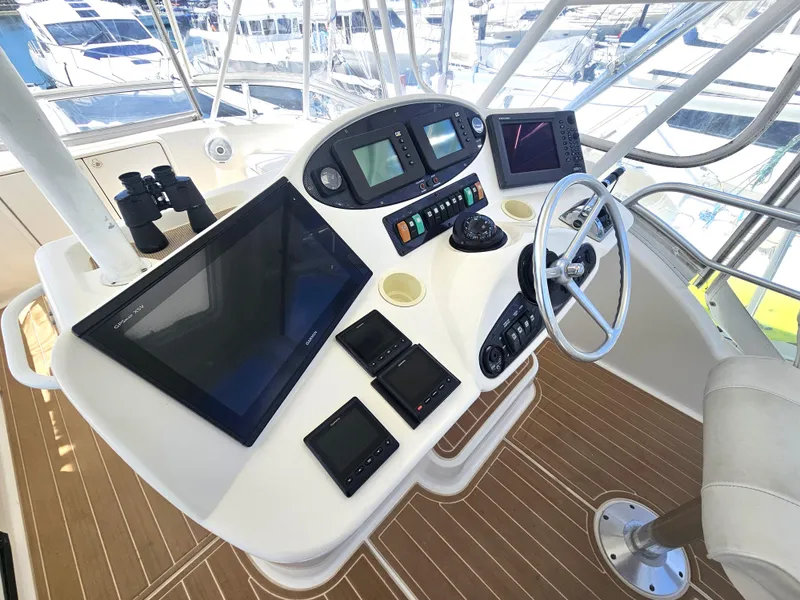 Slide: The Image of 2005 Riviera 42 Flybridge helm with modern electronics. - 2