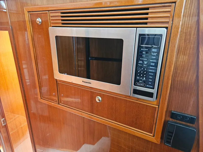 Slide: The Image of Built-in microwave in 2005 Riviera 42 Flybridge yacht. - 25