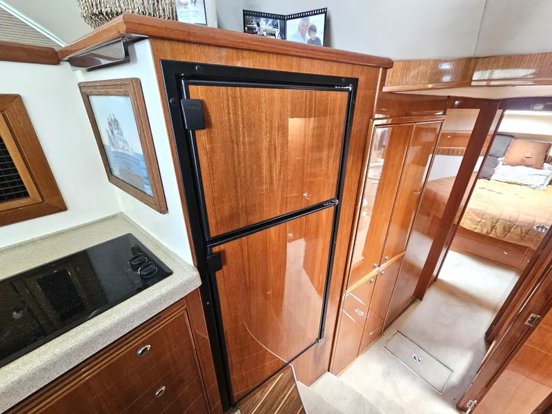 Slide: The Image of Interior of 2005 Riviera 42 Flybridge with wood finish. - 26