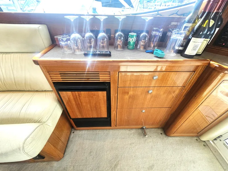Slide: The Image of Interior of 2005 Riviera 42 Flybridge with bar area and glasses. - 27