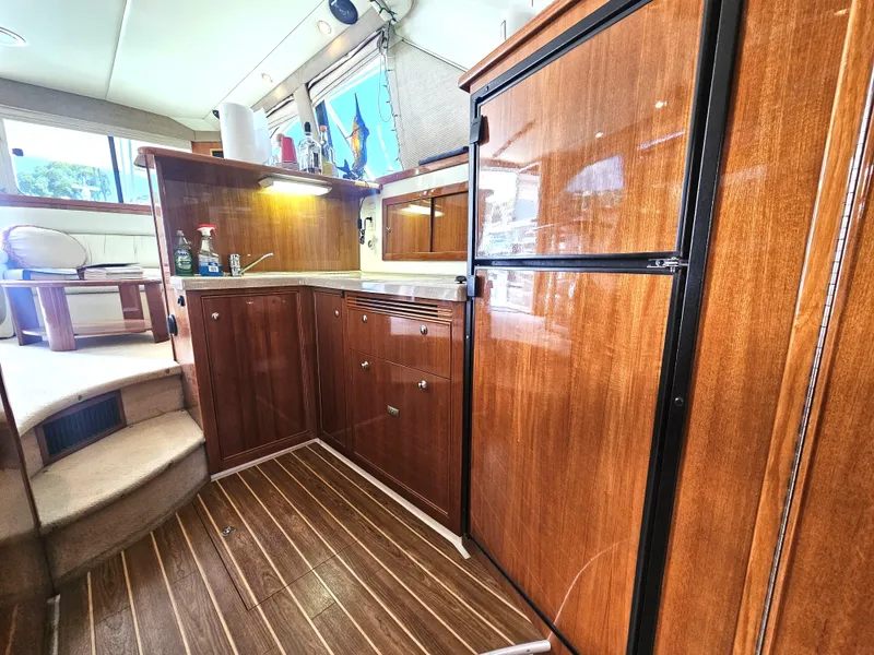 Slide: The Image of 2005 Riviera 42 Flybridge yacht interior kitchen area. - 28