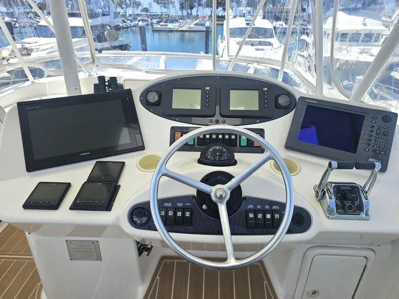 Slide: The Image of 2005 Riviera 42 Flybridge helm with navigation equipment. - 3