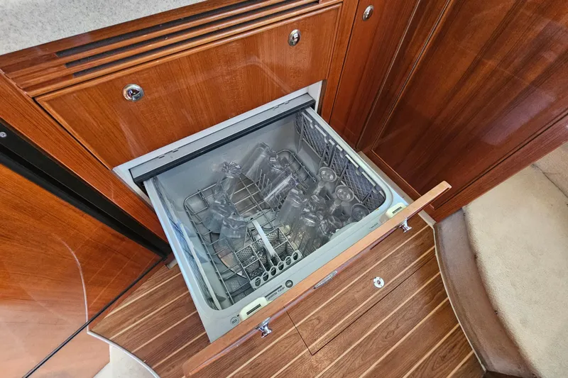 Slide: The Image of Open dishwasher in 2005 Riviera 42 Flybridge yacht kitchen. - 30