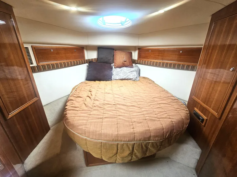 Slide: The Image of 2005 Riviera 42 Flybridge cabin interior with bed. - 35