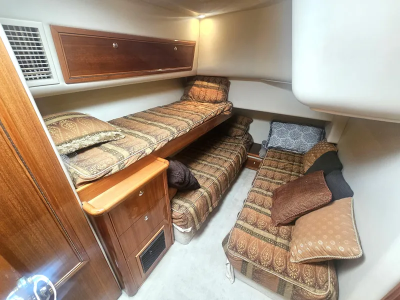 Slide: The Image of 2005 Riviera 42 Flybridge cabin with cozy twin beds. - 36