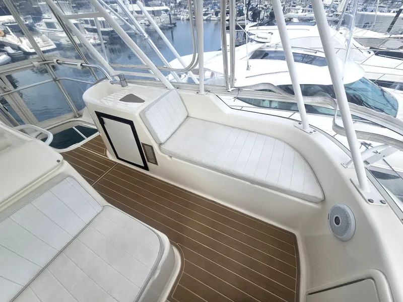 Slide: The Image of Riviera 42 Flybridge 2005 with elegant flybridge and marina view. - 4