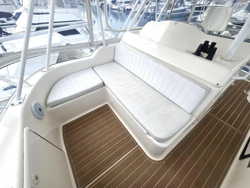 Slide: The Image of Riviera 42 Flybridge 2005 with white seating area and wood flooring. - 6