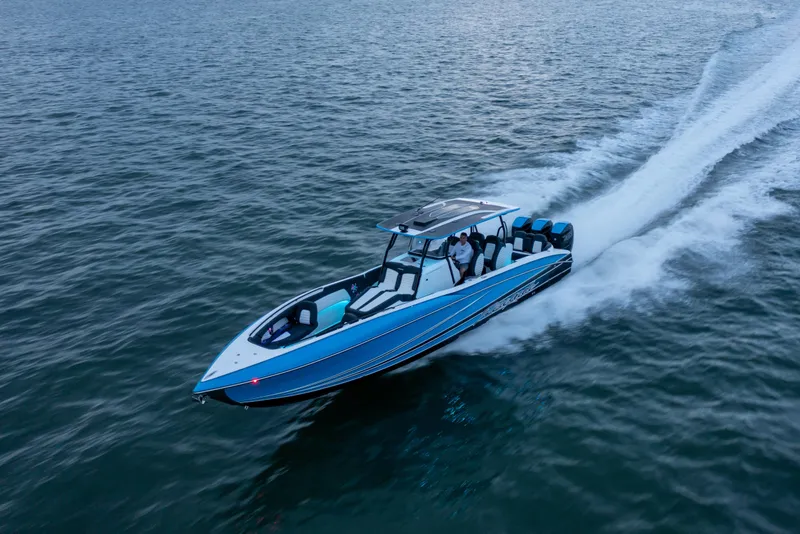 Slide: The Image of 2022 Renegade 38' Open boat cruising on open water at high speed. - 8