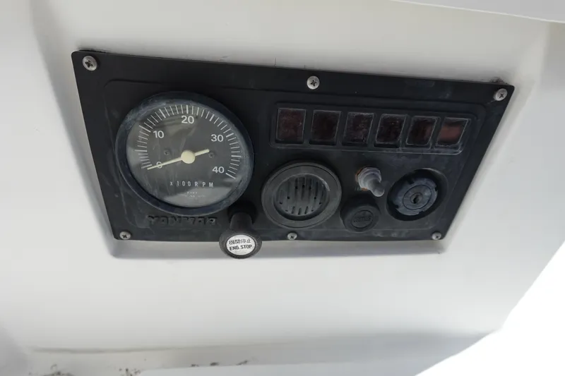 Slide: The Image of Control panel of a 1987 Hunter 310 boat with gauge and switches. - 16