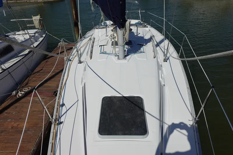 Slide: The Image of 1987 Hunter 310 sailboat deck view at marina. - 17