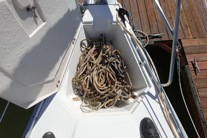 Slide: The Image of Anchor locker with coiled ropes on a 1987 Hunter 310 sailboat. - 19